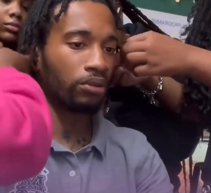 Students unbraiding teachers hair